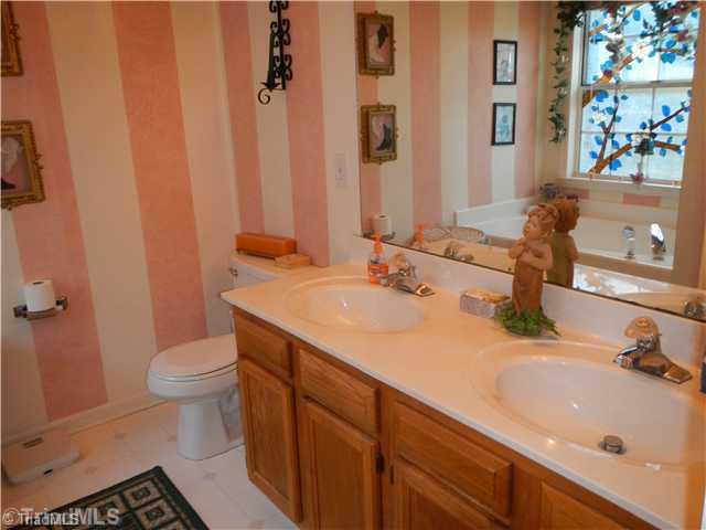 4103 Chilton Way High Point, NC 27265 - Photo 8 of 14 Master Bath/Spa. Master bath has dual vanity sinks, soaking tub and separate shower.