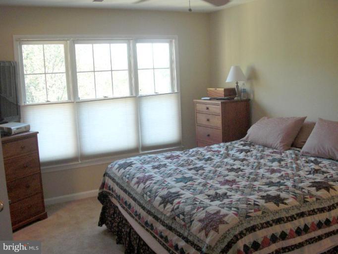 1234 Weatherstone Court Reston, VA 20194 - Photo 7 of 18 a bedroom with a bed and a window