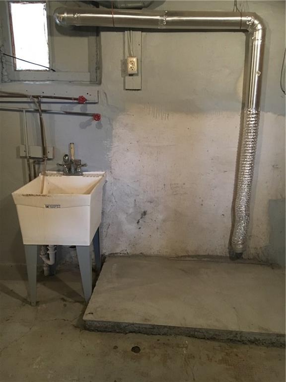 23 Main Street Freeport, PA 16229 - Photo 17 of 17 Basement is freshly painted with washer/dryer hook-up with utility sink, high ceiling & walk-out to side of house