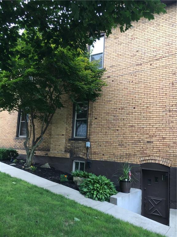 23 Main Street Freeport, PA 16229 - Photo 4 of 17 Side of house with great landscaping and walk-out from basement.