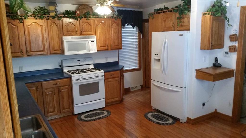 23 Main Street Freeport, PA 16229 - Photo 5 of 17 Beautiful oak cabinets and hardwood floors in kitchen