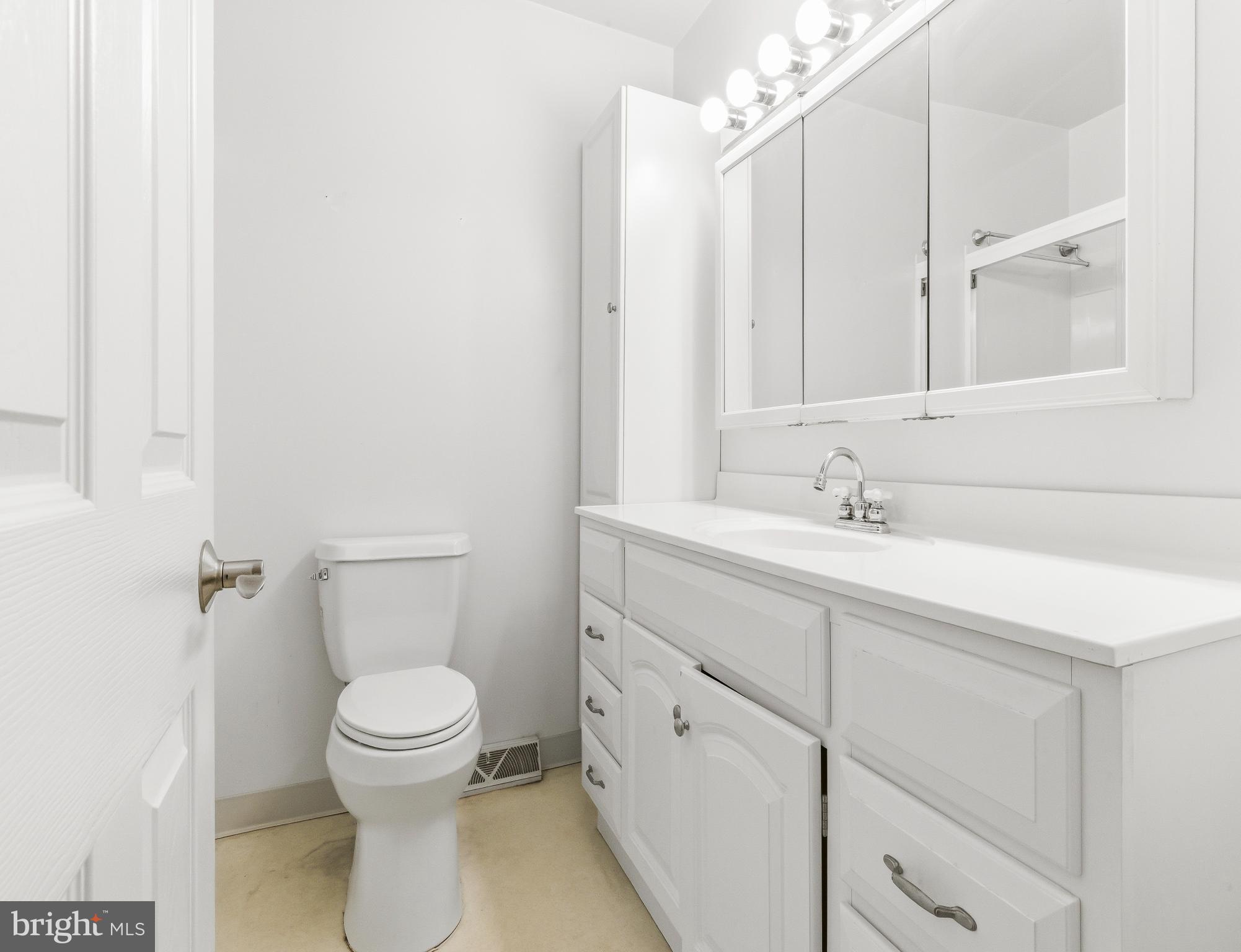 412 Alcyon Boulevard Pitman, NJ 08071 - Photo 20 of 22 a bathroom with a sink toilet and vanity