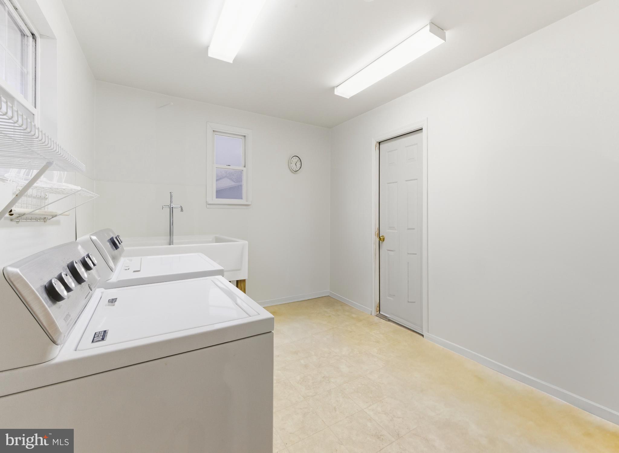 412 Alcyon Boulevard Pitman, NJ 08071 - Photo 22 of 22 a utility room with dryer and washer
