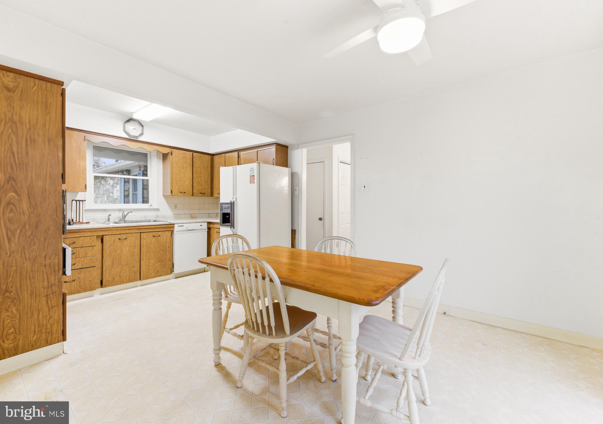 412 Alcyon Boulevard Pitman, NJ 08071 - Photo 5 of 22 a view of a dining room with furniture and a kitchen