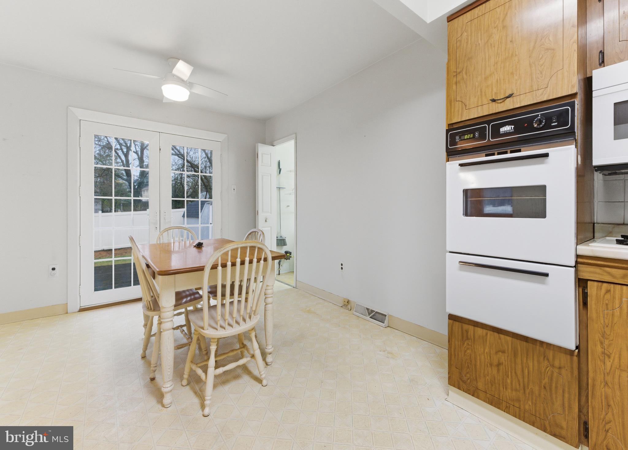 412 Alcyon Boulevard Pitman, NJ 08071 - Photo 7 of 22 a view of a kitchen with furniture and windows