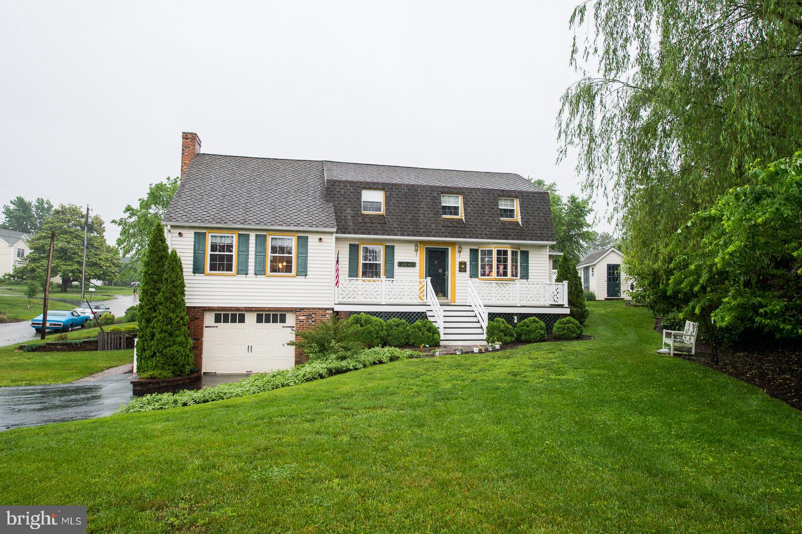 1251 Turkey Point Road Edgewater, MD 21037 - Photo 1 of 32 a front view of a house with a yard