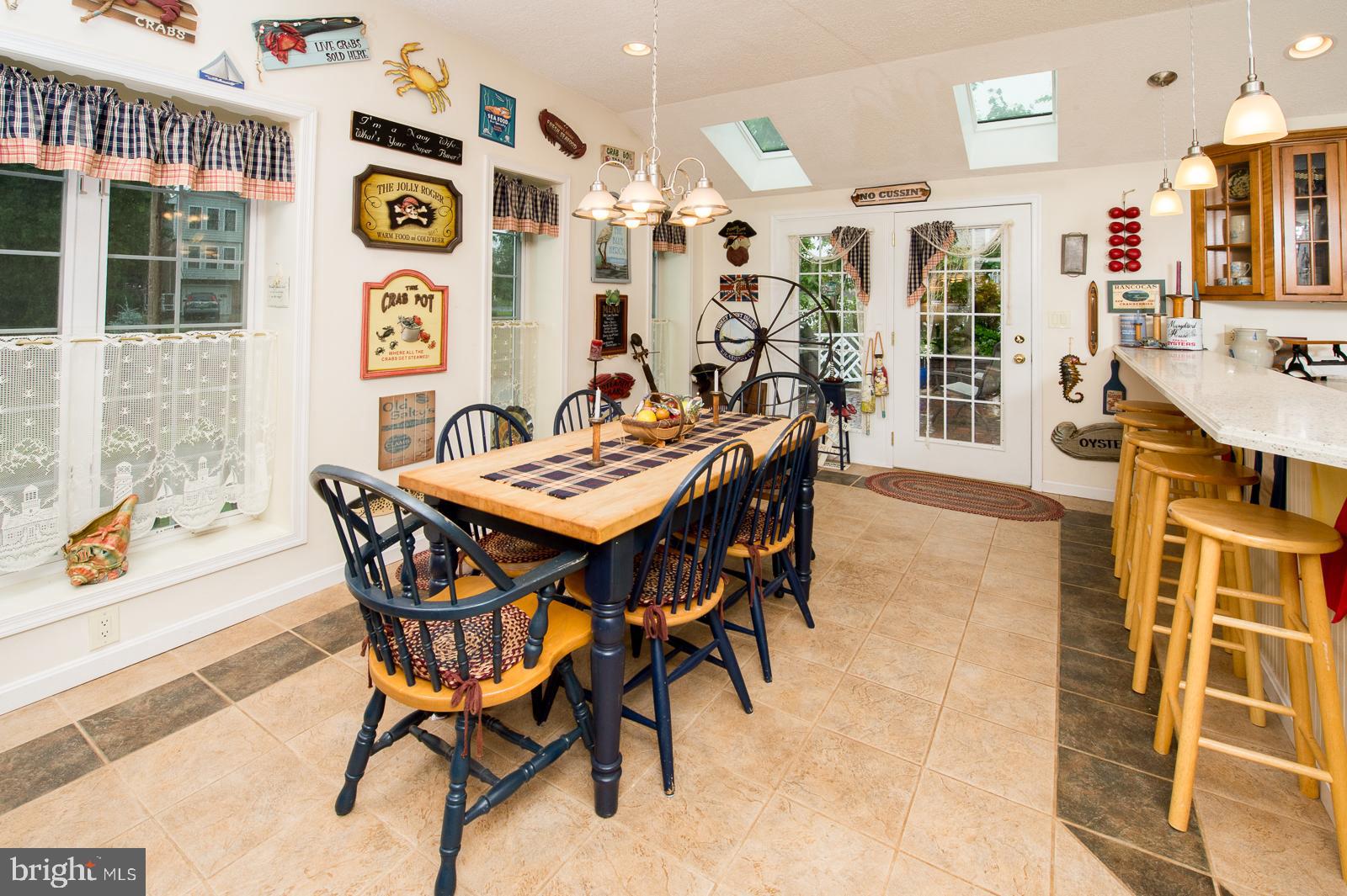 1251 Turkey Point Road Edgewater, MD 21037 - Photo 12 of 32 a view of a dining room with furniture