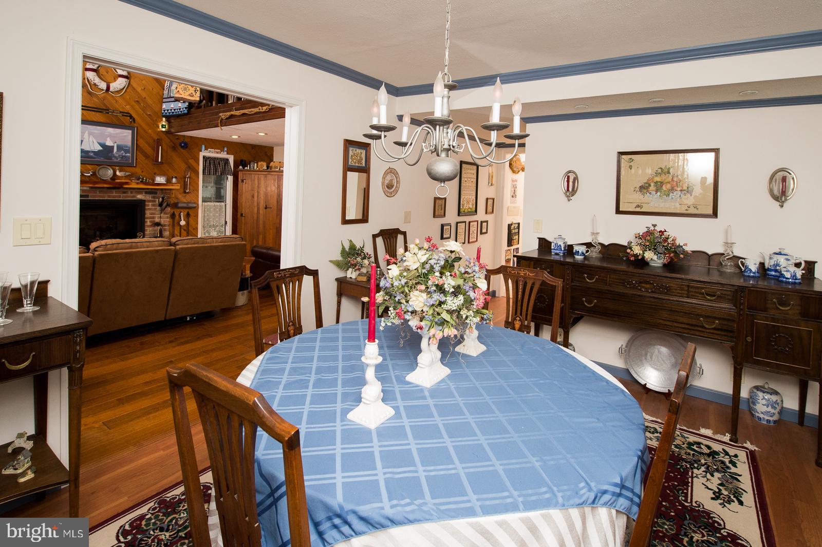 1251 Turkey Point Road Edgewater, MD 21037 - Photo 5 of 32 a dining room with furniture and wooden floor