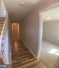 a view of a hallway with staircase