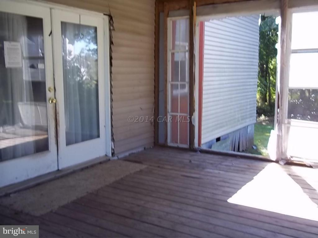 27223 Mt Vernon Road Princess Anne, MD 21853 - Photo 10 of 11 an empty room with wooden floor and windows