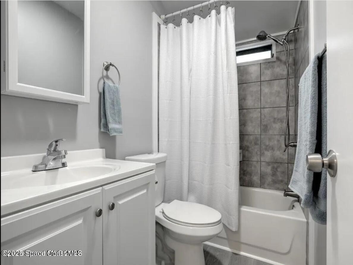 7560 Blackhawk Road Sebastian, FL 32976 - Photo 11 of 13 a bathroom with a sink toilet and shower