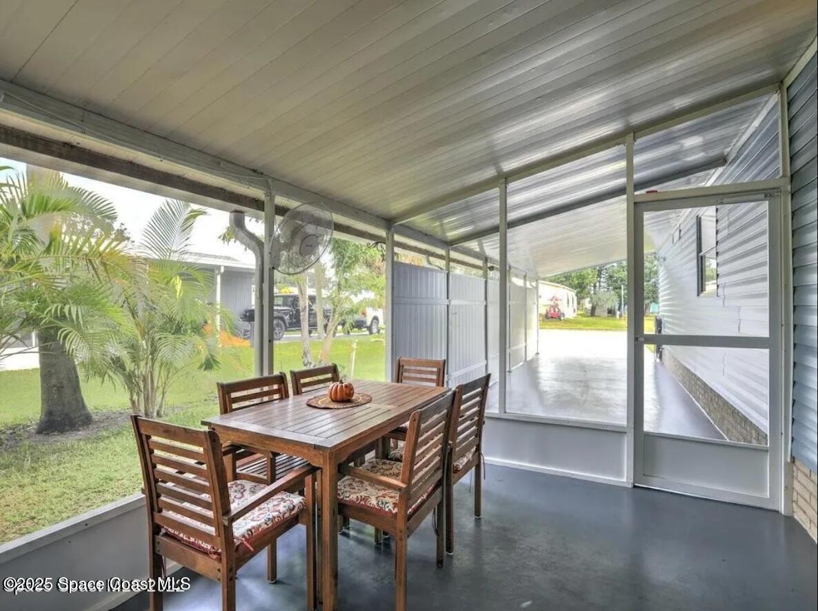 7560 Blackhawk Road Sebastian, FL 32976 - Photo 13 of 13 a view of a dining room with furniture window and outside view