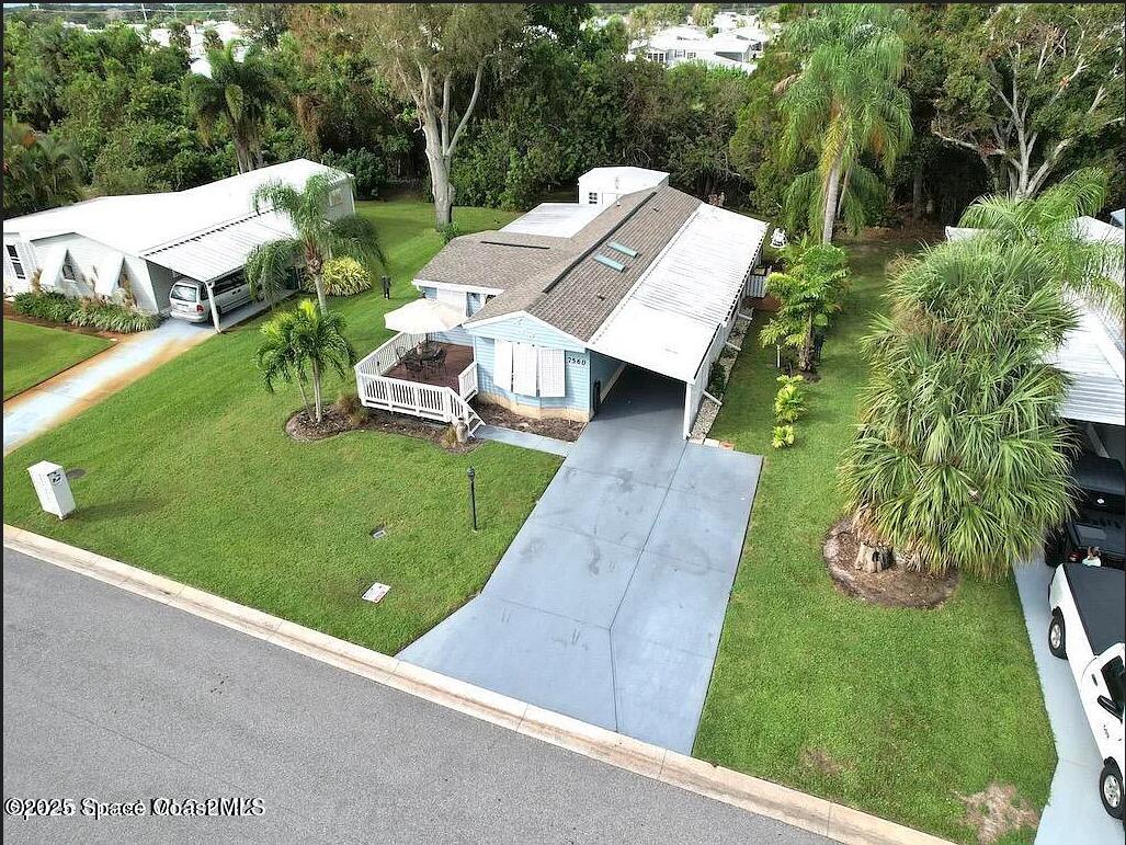 7560 Blackhawk Road Sebastian, FL 32976 - Photo 2 of 13 an aerial view of a house with swimming pool garden and patio