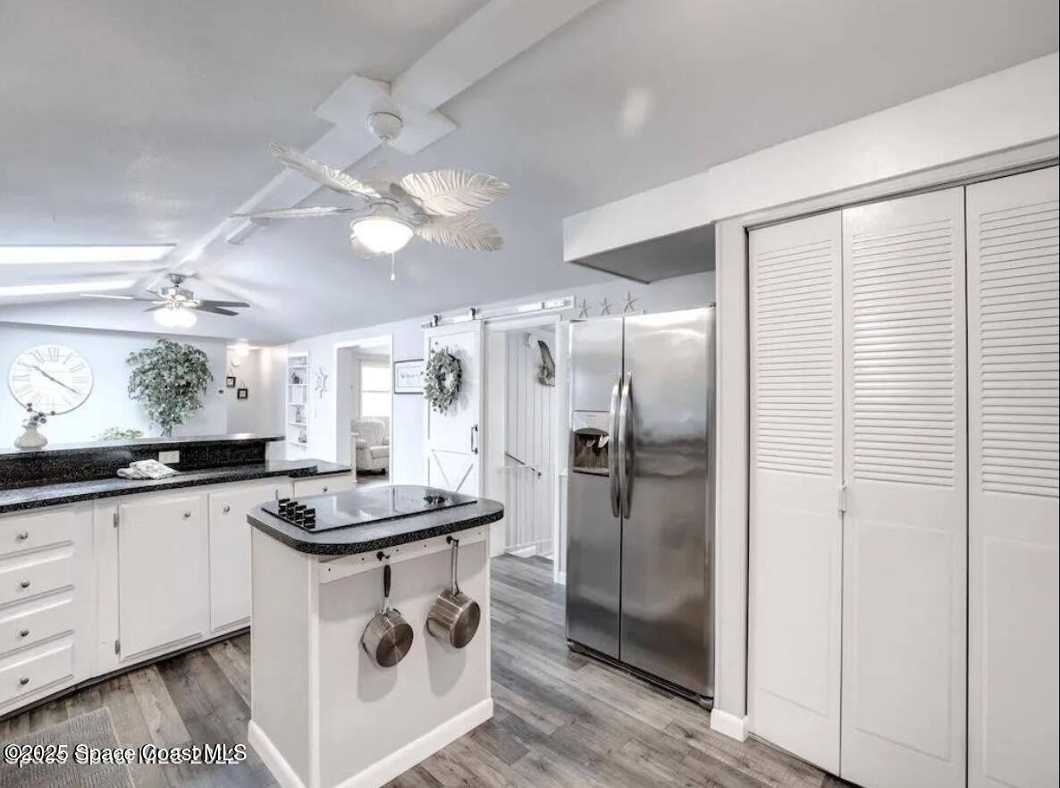 7560 Blackhawk Road Sebastian, FL 32976 - Photo 4 of 13 a kitchen with granite countertop a sink a counter space and stainless steel appliances