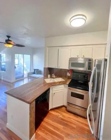 a kitchen with a stove a sink and a refrigerator