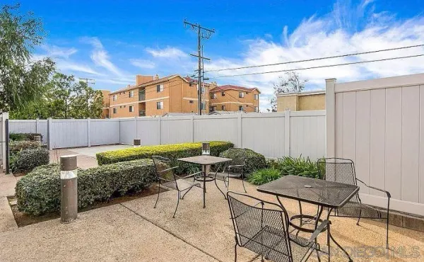 a view of backyard with furniture and outdoor