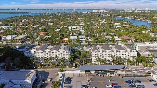 an aerial view of residential houses and city view