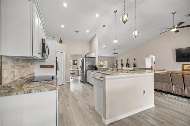 a large kitchen with cabinets