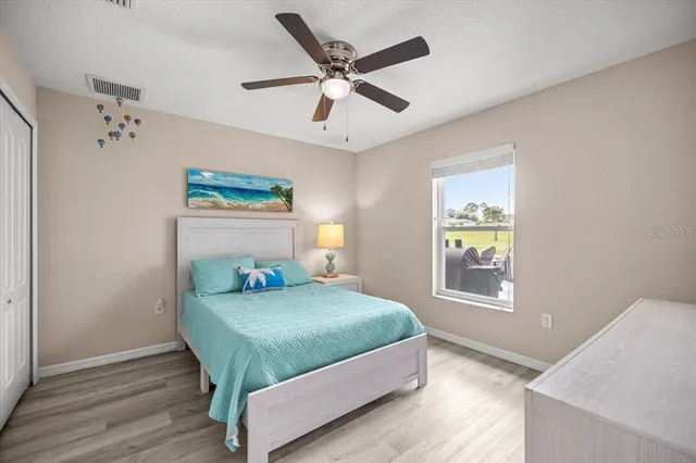 a bedroom with a bed and window