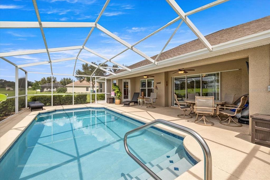 700 East Boston Street Hernando, FL 34442 - Photo 27 of 40 a view of a patio with dining table and chairs under an umbrella