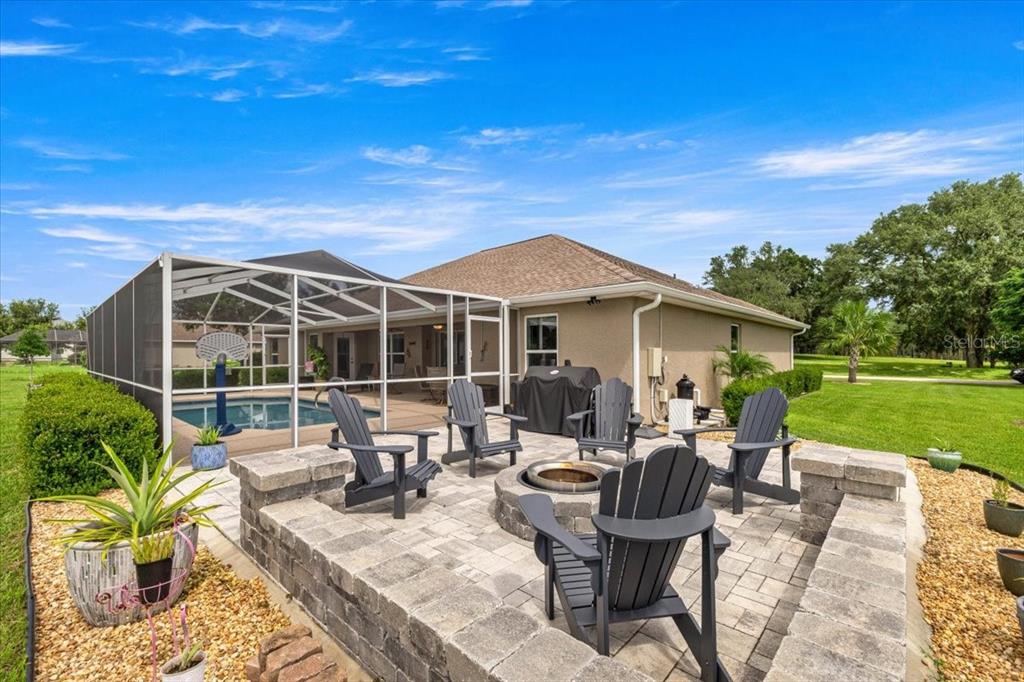 700 East Boston Street Hernando, FL 34442 - Photo 28 of 39 a view of a house with backyard sitting area and garden