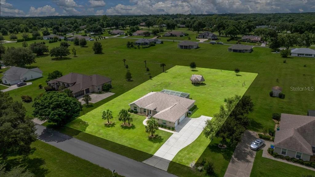 700 East Boston Street Hernando, FL 34442 - Photo 3 of 40 an aerial view of a golf course with parking space