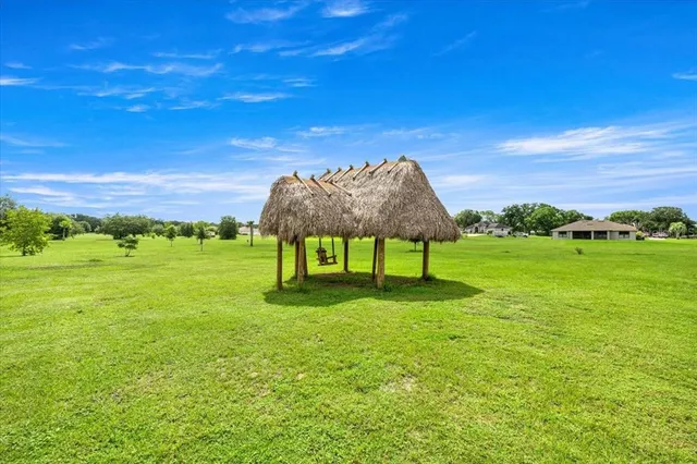 a view of a garden with a table and a chair