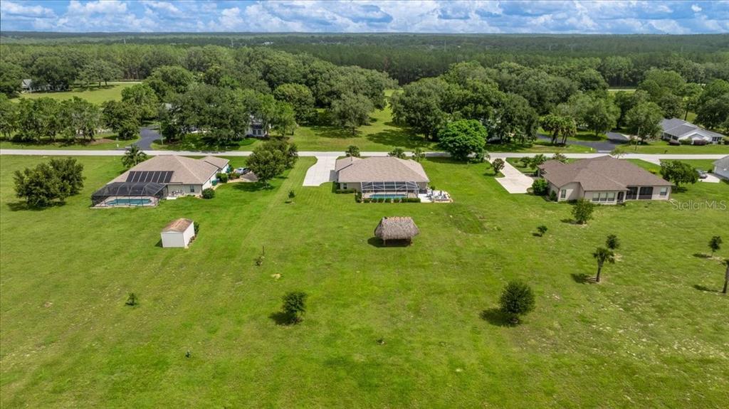 700 East Boston Street Hernando, FL 34442 - Photo 37 of 40 a backyard of a house with yard and outdoor seating