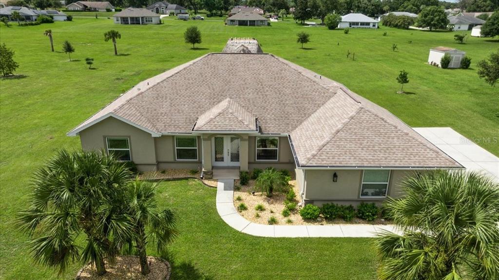 700 East Boston Street Hernando, FL 34442 - Photo 5 of 39 a aerial view of a house with a yard table and chairs
