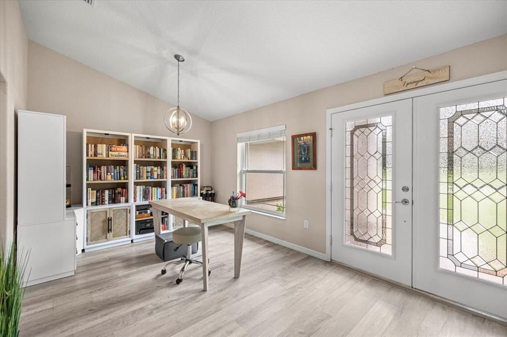 700 East Boston Street Hernando, FL 34442 - Photo 5 of 40 a workspace with furniture window and wooden floor