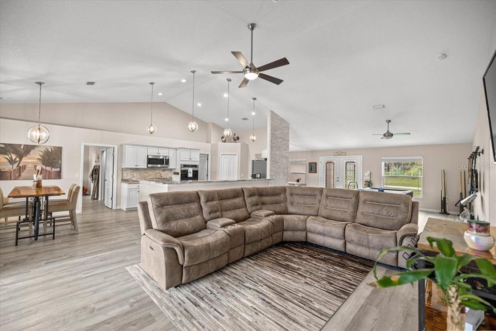 700 East Boston Street Hernando, FL 34442 - Photo 7 of 39 a living room with furniture and wooden floor