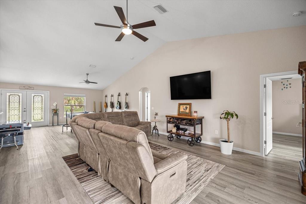 700 East Boston Street Hernando, FL 34442 - Photo 9 of 39 a living room with furniture and a flat screen tv