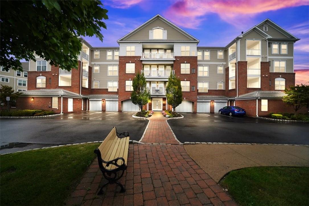 a view of a brick house with a yard