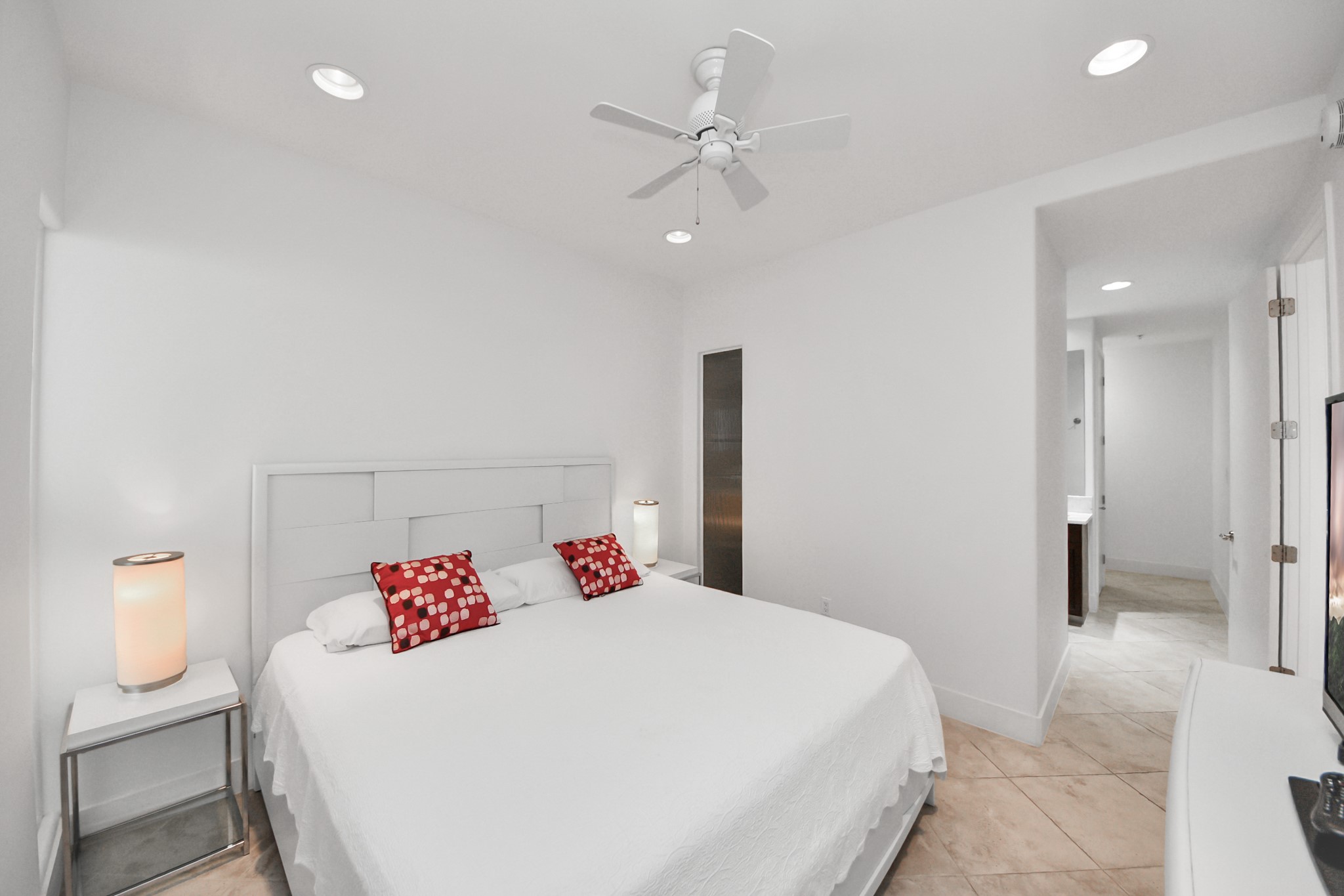 10327 Termini-San Luis Pass Road, Unit 617 Galveston, TX 77554 - Photo 15 of 50 a bedroom with a bed and a chandelier