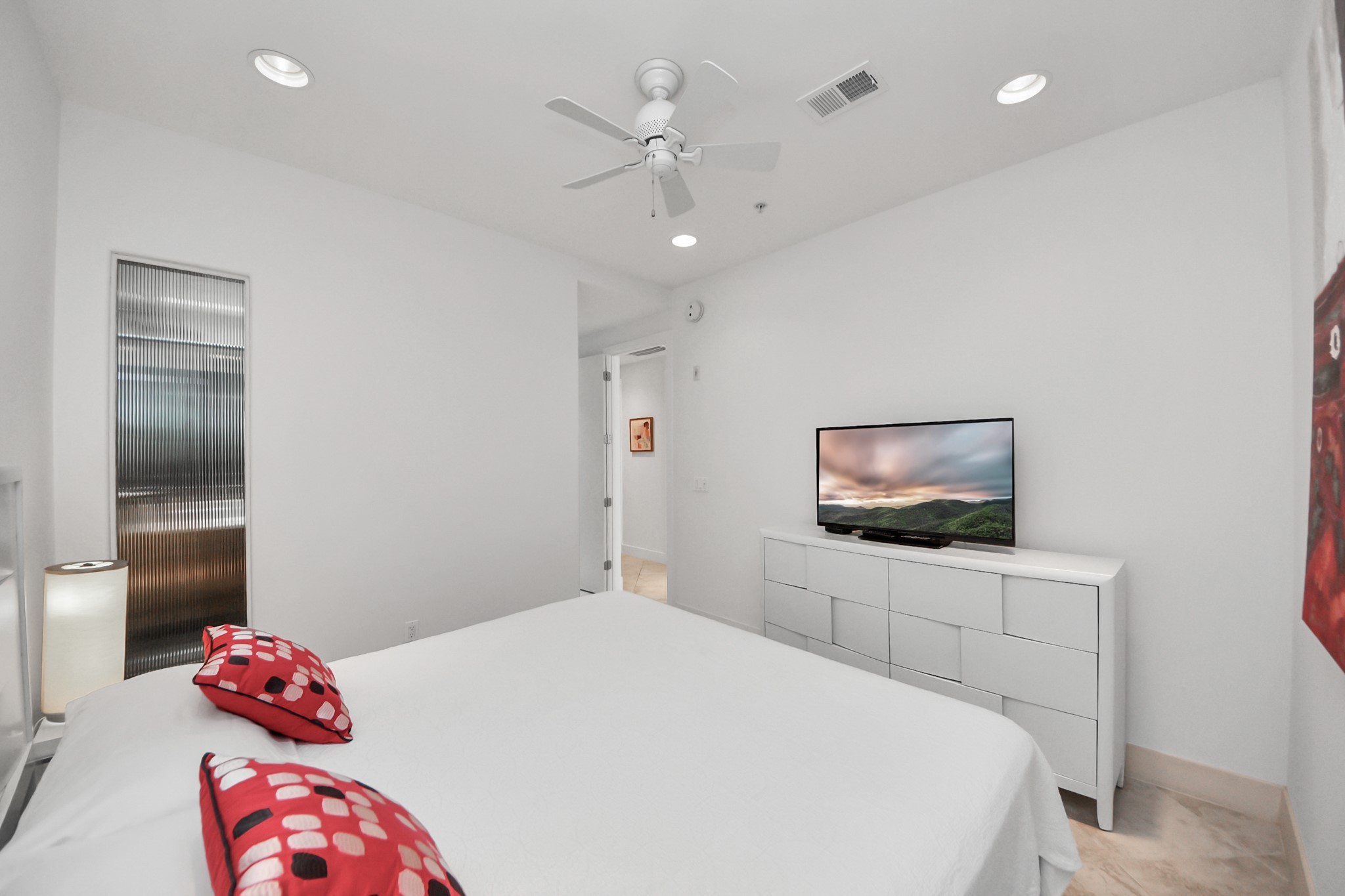 10327 Termini-San Luis Pass Road, Unit 617 Galveston, TX 77554 - Photo 17 of 50 a bedroom with a bed and a flat screen tv