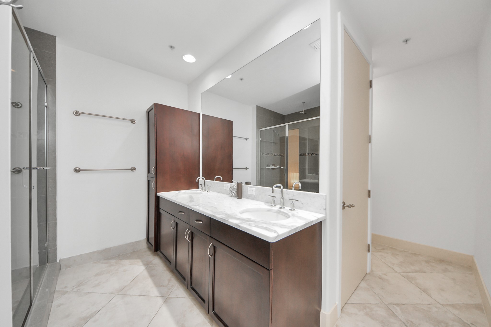 10327 Termini-San Luis Pass Road, Unit 617 Galveston, TX 77554 - Photo 21 of 50 a bathroom with a sink and a mirror