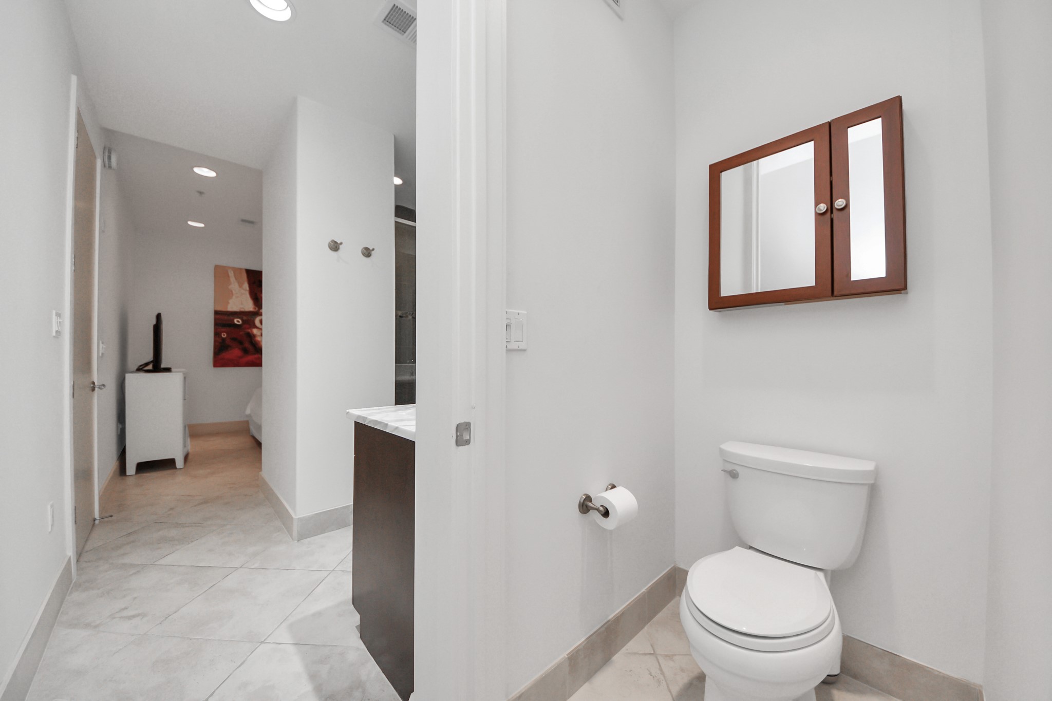 10327 Termini-San Luis Pass Road, Unit 617 Galveston, TX 77554 - Photo 23 of 50 a bathroom with a toilet sink and shower