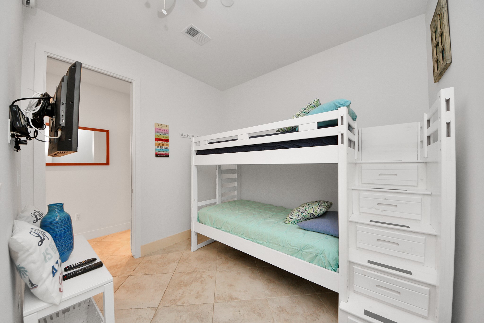 10327 Termini-San Luis Pass Road, Unit 617 Galveston, TX 77554 - Photo 25 of 50 a bedroom with a bed and a chair