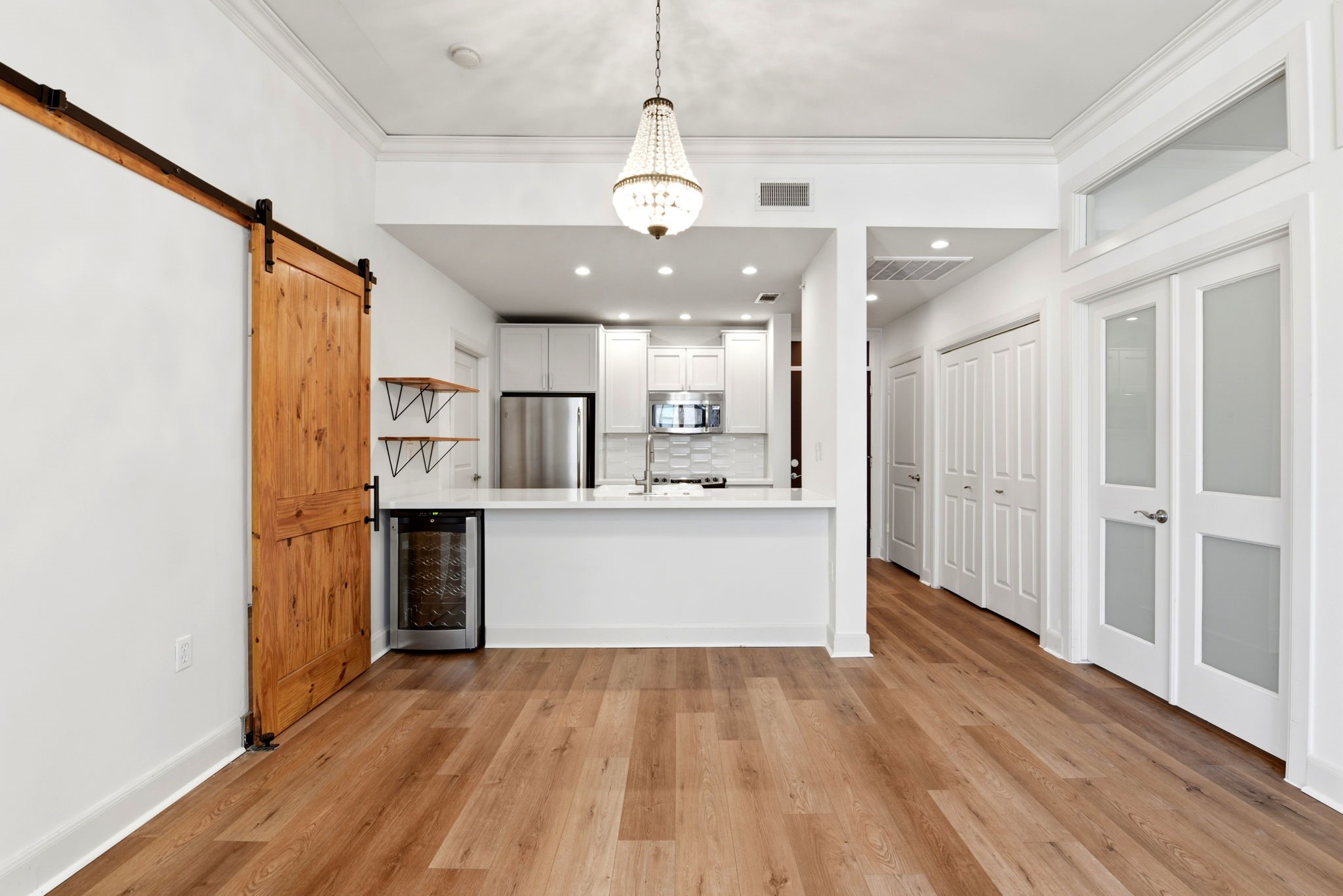 1010 Rosine Street, Unit 43 Houston, TX 77019 - Photo 20 of 48 a view of a kitchen with wooden floor and a window