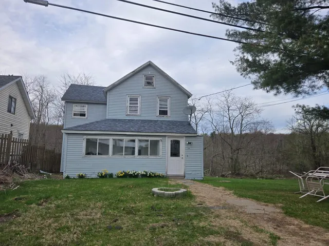 a view of a house with a yard