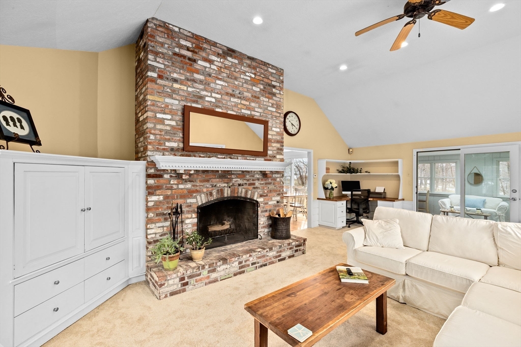 9 Windward Lane Scituate, MA 02066 - Photo 11 of 37 a living room with furniture and a fireplace