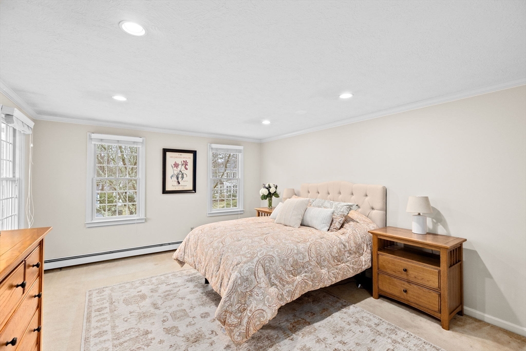 9 Windward Lane Scituate, MA 02066 - Photo 19 of 37 a bedroom with a bed and a window