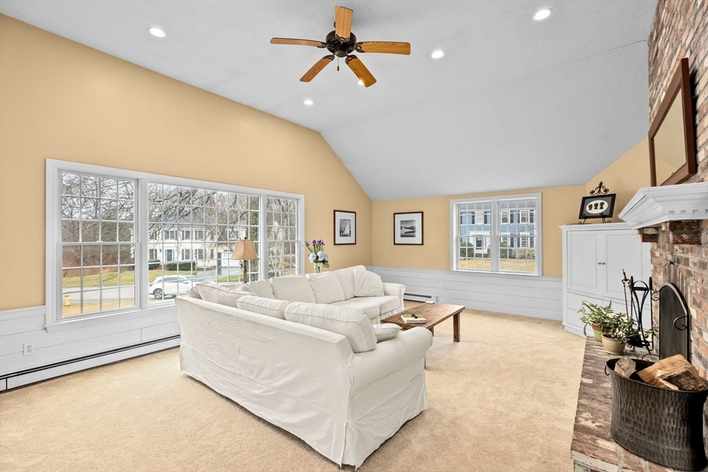 9 Windward Lane Scituate, MA 02066 - Photo 10 of 37 a living room with furniture and a flat screen tv