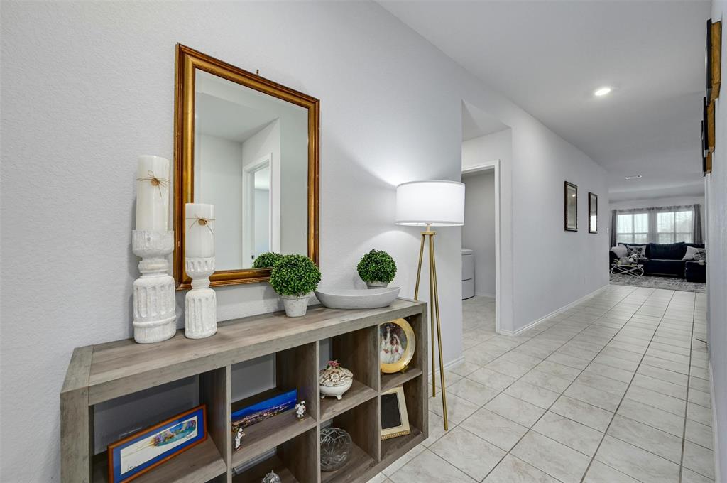 1045 Taggart Trail Jarrell, TX 76537 - Photo 3 of 19 Corridor with light tile patterned floors and recessed lighting