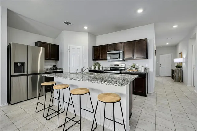a view of a dining room with furniture and window