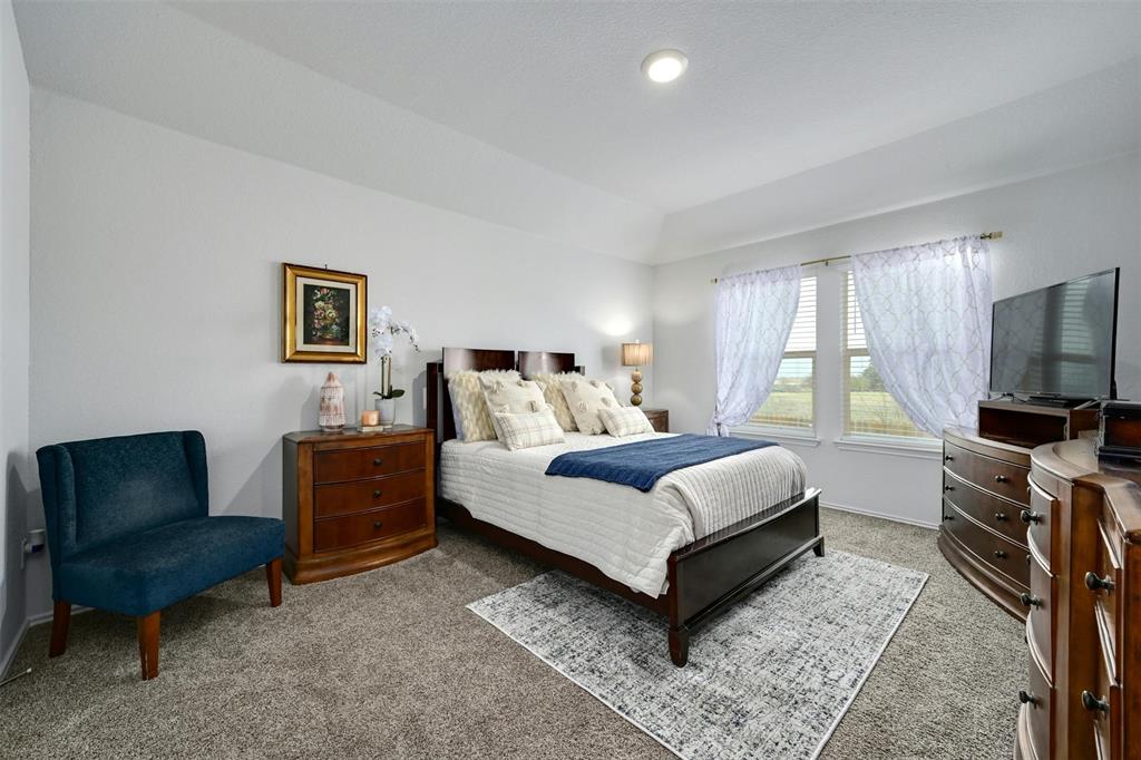 1045 Taggart Trail Jarrell, TX 76537 - Photo 9 of 19 Bedroom featuring carpet floors and baseboards