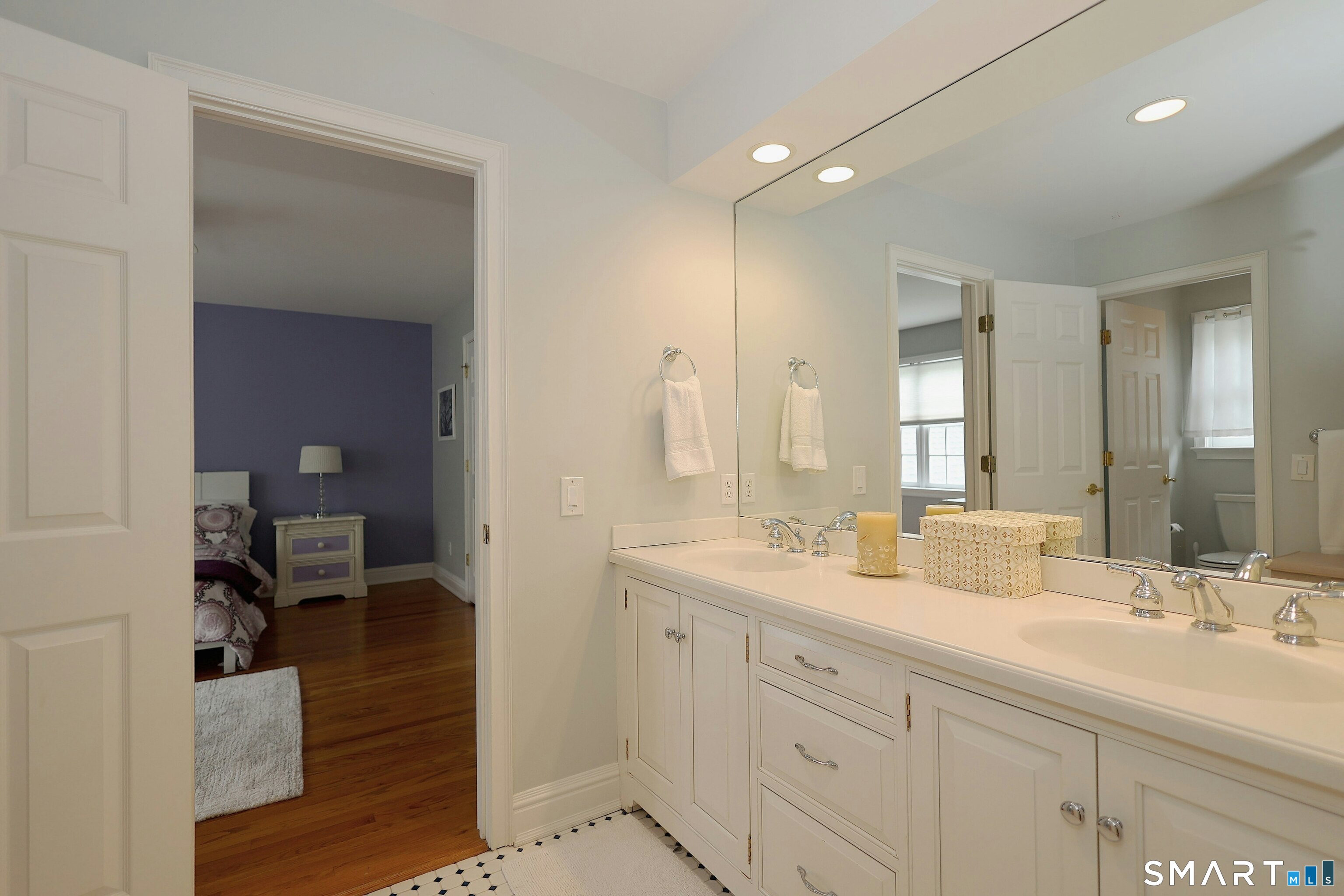 30 Whipstick Road Ridgefield, CT 06877 - Photo 32 of 40 a spacious bathroom with a double vanity sink and mirror