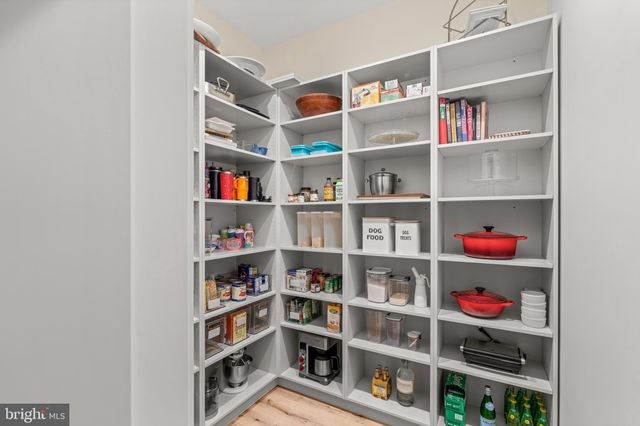 a living room with furniture potted plant and a fireplace