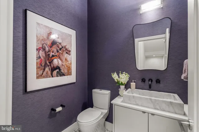 a bathroom with a double vanity sink mirror and