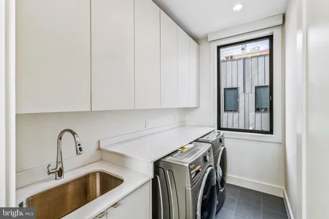 a bathroom with a sink toilet a mirror and shower